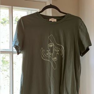 Teal/Green tee with facial design from Bohme